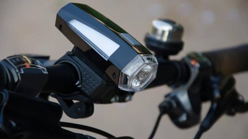 a close up of a black bicycle light