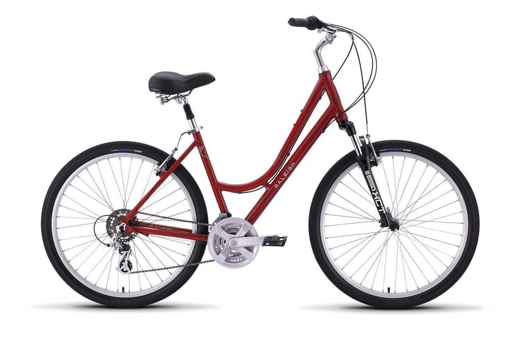 a red and silver raleigh step through bicycle