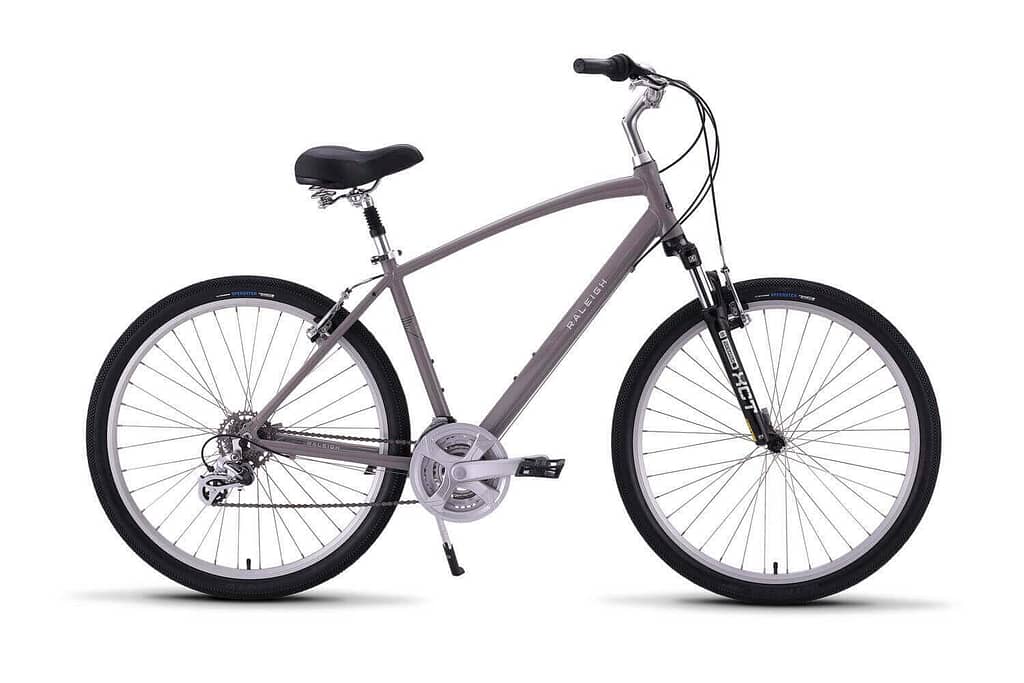 a grey raleigh venture 2 bicycle with black wheels