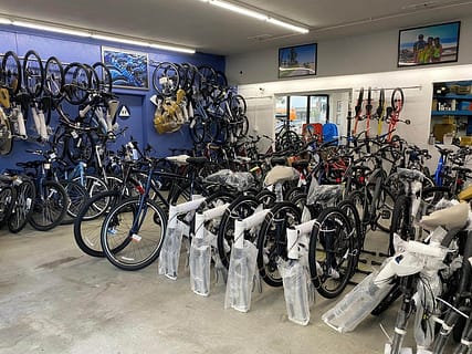 a row of bicycles wrapped up in a bike shop